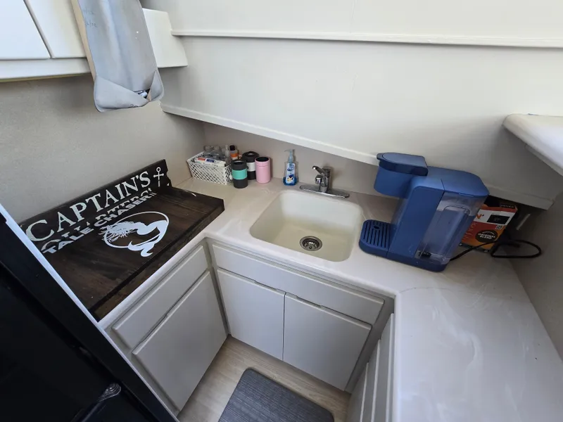 Slide: The Image of Compact galley kitchen in 1998 Henriques 38 Sportfisherman with sink and coffee maker. - 12