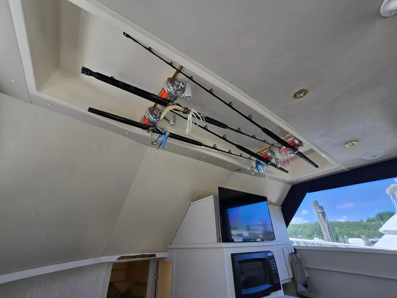 Slide: The Image of Interior of 1998 Henriques 38 Sportfisherman with fishing rods and modern amenities. - 14