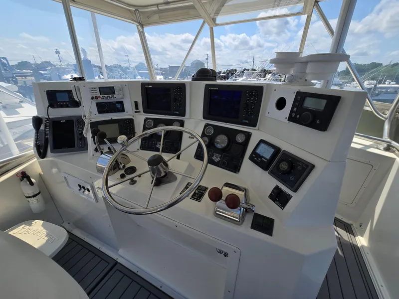Slide: The Image of Helm of 1998 Henriques 38 Sportfisherman with navigation instruments and steering wheel. - 17