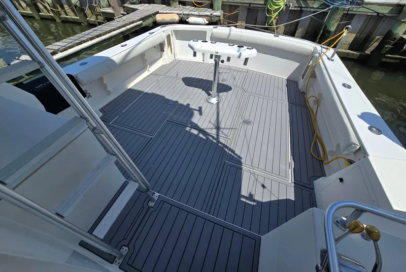 Slide: The Image of Spacious deck of 1998 Henriques 38 Sportfisherman, featuring clean, modern design and ample seating. - 7