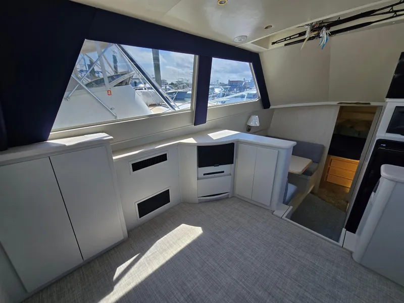 Slide: The Image of Interior of a 1998 Henriques 38 Sportfisherman boat with modern cabinetry and seating. - 9