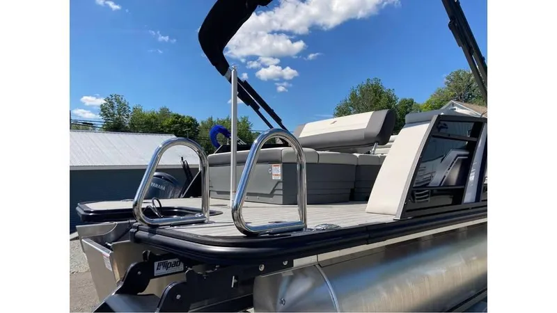 Slide: The Image of 2025 Starcraft EXS 1 Q DH pontoon boat with sleek design and comfortable seating. - 3