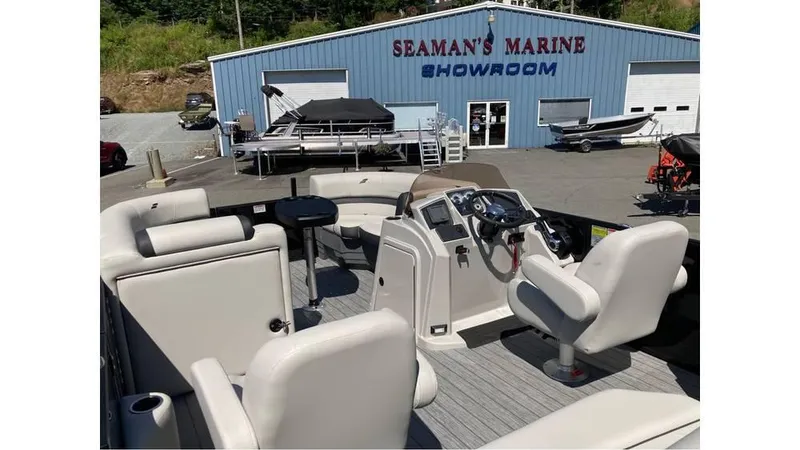 Slide: The Image of 2025 Starcraft EXS 1 Q DH boat interior at Seaman's Marine showroom. - 5