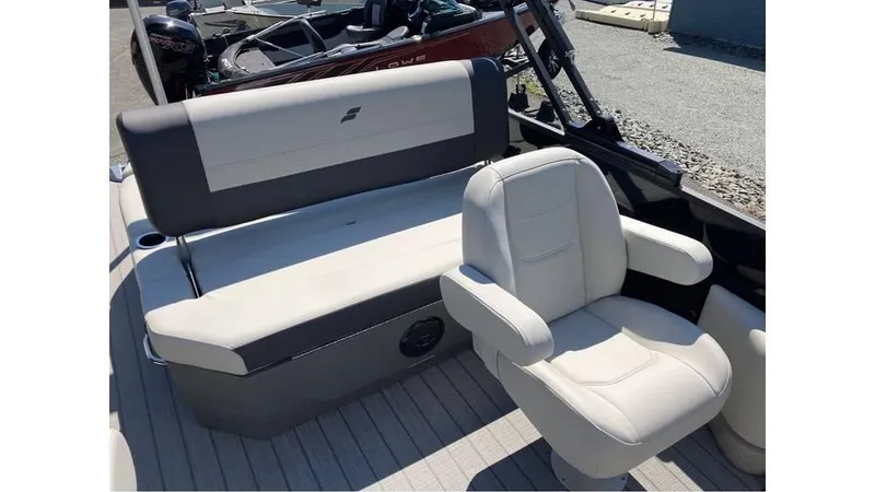 Slide: The Image of 2025 Starcraft EXS 1 Q DH boat interior with white seating and modern design. - 6