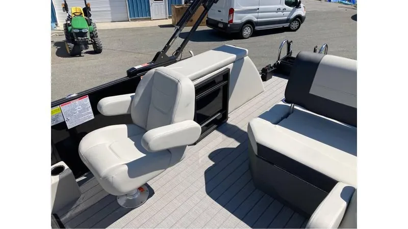 Slide: The Image of 2025 Starcraft EXS 1 Q DH boat interior with white seating and modern design. - 7