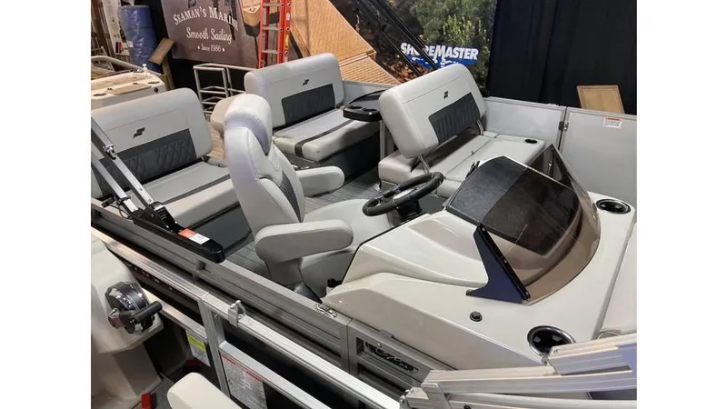 Slide: The Image of 2025 Starcraft CX 23 RL boat interior with modern seating and steering console. - 4