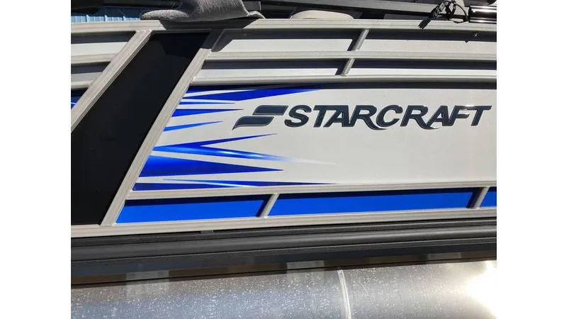 Slide: The Image of 2025 Starcraft CX 23 RL boat with sleek blue and silver design. - 7