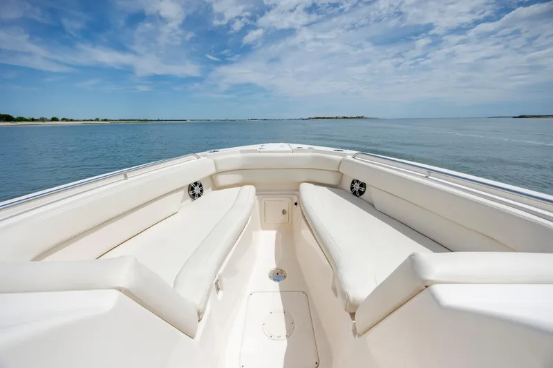 Slide: The Image of 2020 Grady-White Freedom 307 boat interior with spacious seating, ocean view. - 20