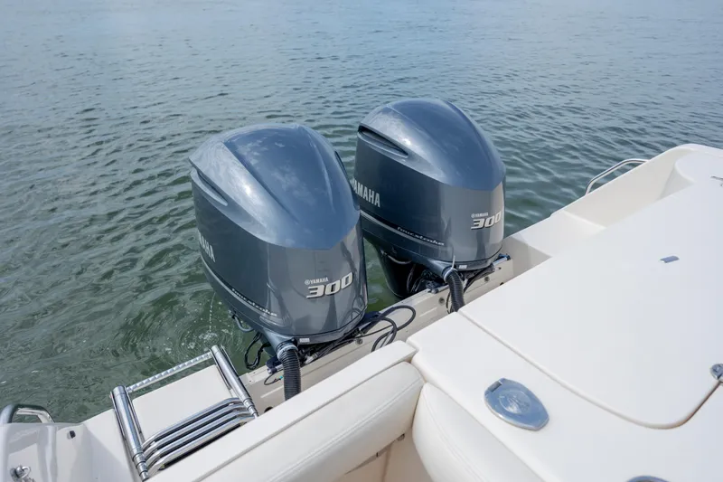 Slide: The Image of 2020 Grady-White Freedom 307 with twin Yamaha 300 engines on calm water. - 8
