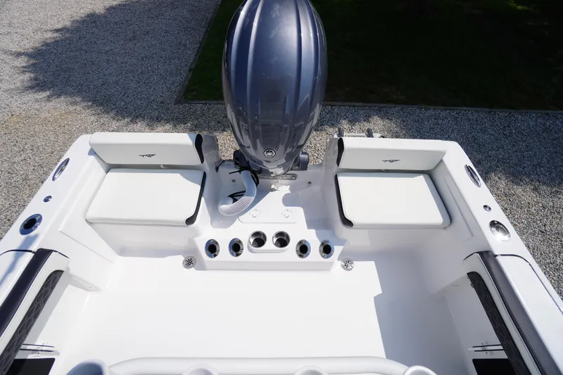 Slide: The Image of 2026 Tidewater 198 CC Adventure boat interior with engine and seating. - 34