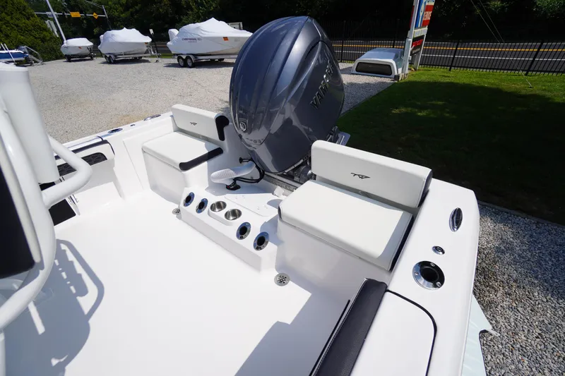 Slide: The Image of 2026 Tidewater 198 CC Adventure boat with Yamaha outboard engine, featuring white seating and cup holders. - 36