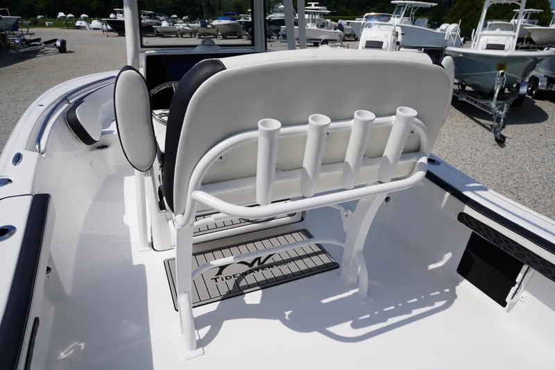 Slide: The Image of 2026 Tidewater 198 CC Adventure boat interior with rod holders and seating. - 39