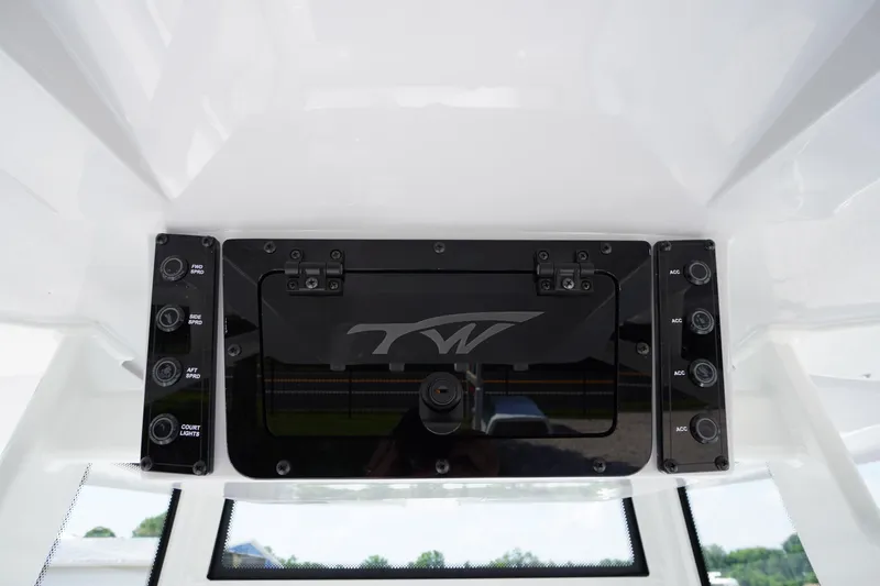 Slide: The Image of 2026 Tidewater 198 CC Adventure boat console with control panel and storage compartment. - 43