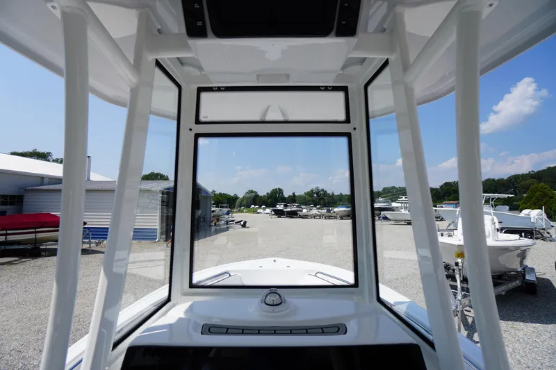 Slide: The Image of 2026 Tidewater 198 CC Adventure boat interior view at a marina. - 45