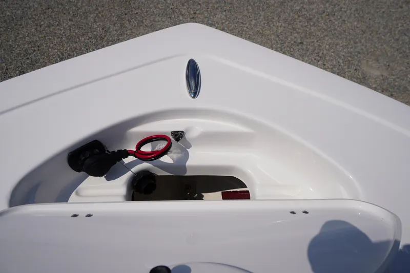 Slide: The Image of Bow storage compartment of 2026 Tidewater 198 CC Adventure boat, featuring sleek white design. - 6