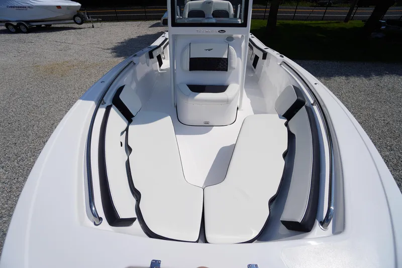 Slide: The Image of 2026 Tidewater 198 CC Adventure boat interior with white seating and sleek design. - 7