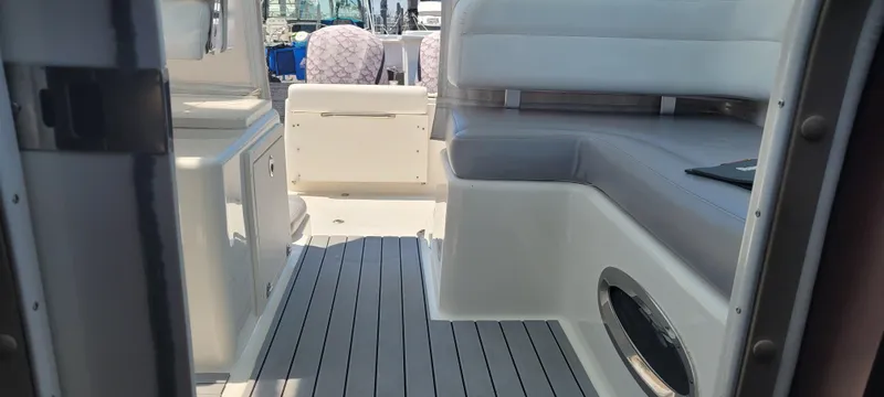 Slide: The Image of Interior view of a 2015 Century 30 boat with seating and storage. - 11