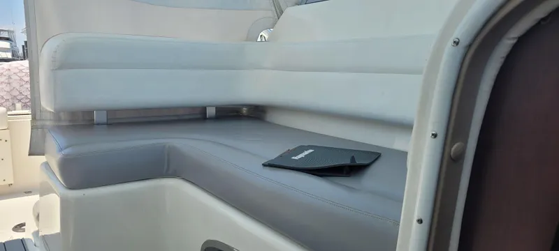 Slide: The Image of Interior seating of a 2015 Century 30 boat with a sleek, modern design. - 17