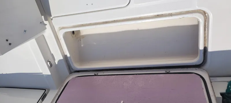 Slide: The Image of Storage compartment on a 2015 Century 30 boat, open and empty. - 23