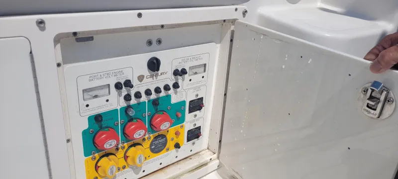Slide: The Image of Control panel of a 2015 Century 30 boat with battery switches and volt meters. - 31