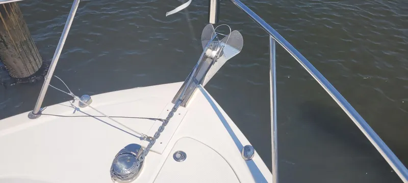 Slide: The Image of Bow of a 2015 Century 30 boat with anchor and railing. - 39