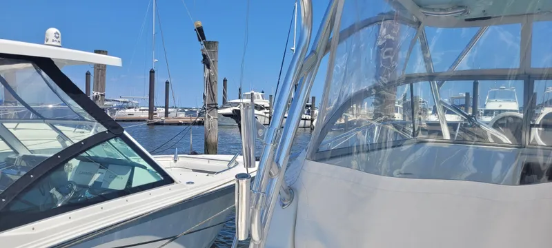 Slide: The Image of Boats docked at a marina, featuring a 2015 Century 30 model. - 40