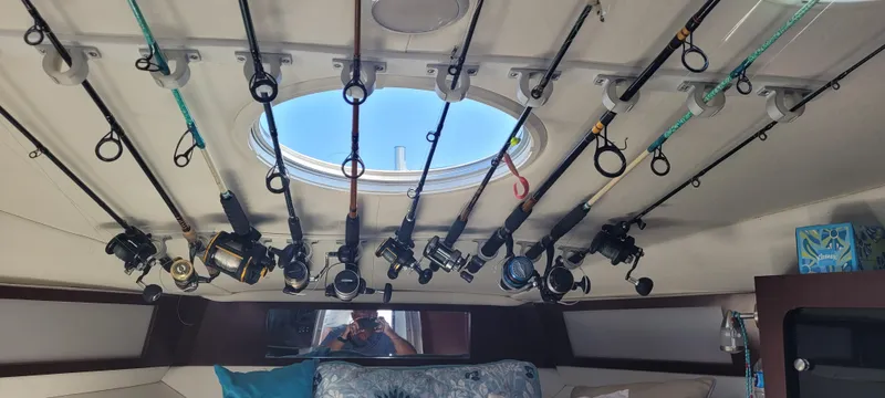 Slide: The Image of Interior of a 2015 Century 30 boat with fishing rods stored on the ceiling. - 43