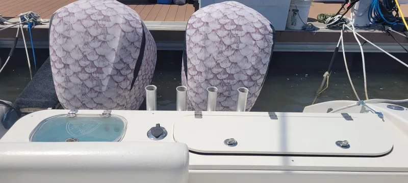 Slide: The Image of Century 30 boat, 2015 model, with covered engines docked at a marina. - 6