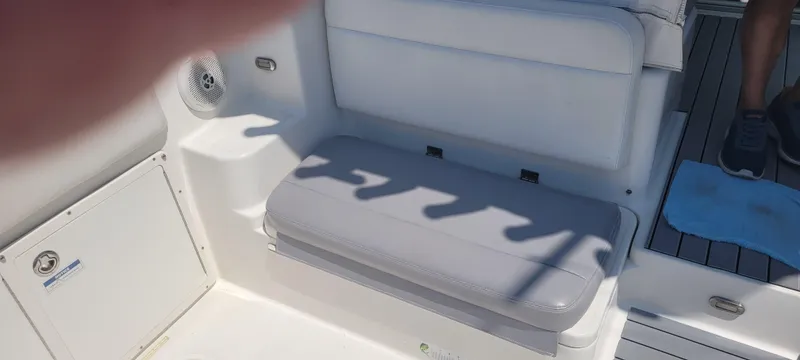 Slide: The Image of Century 30 boat interior, 2015 model, featuring cushioned seating and deck details. - 9