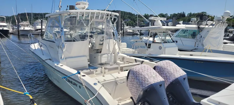 Slide: The Image of 2015 Century 30 boat docked at marina with twin engines. - 4