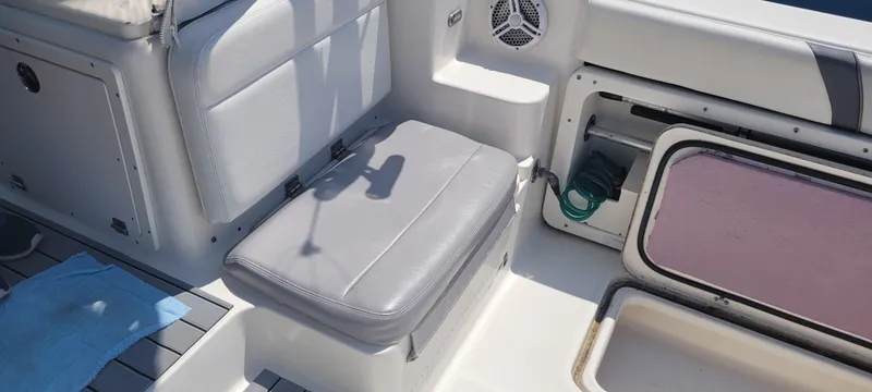 Slide: The Image of Century 30 boat interior, featuring cushioned seating and storage compartments, 2015 model. - 7