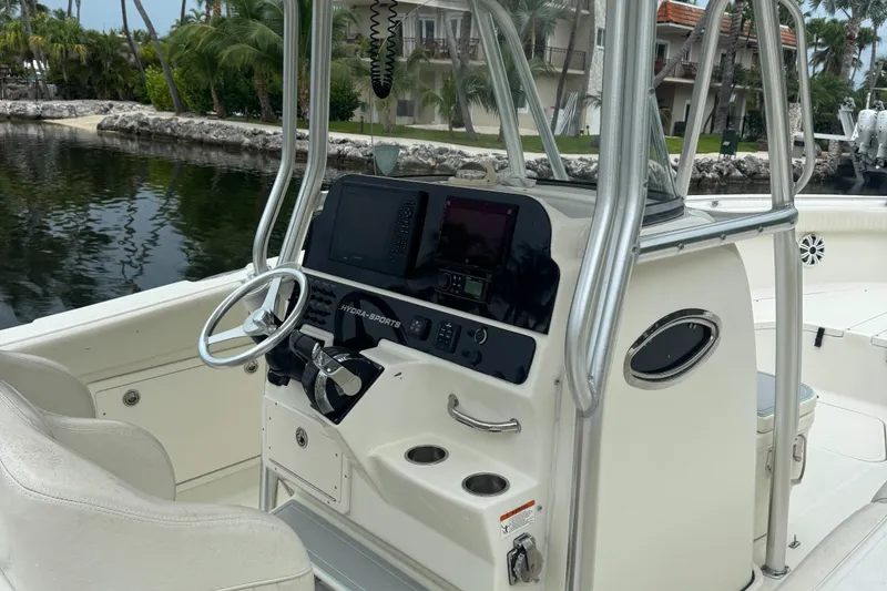 Slide: The Image of 2006 Hydra-Sports Vector 2900 CC boat console with steering wheel and navigation equipment. - 14