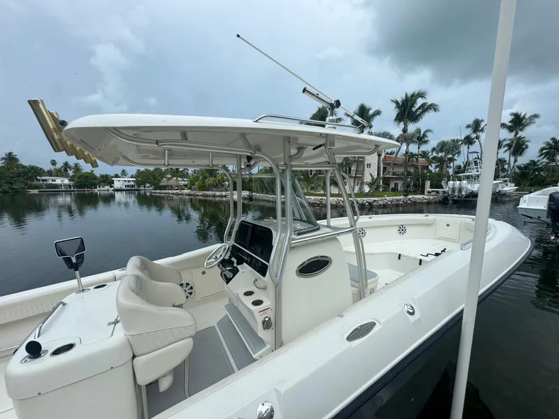 Slide: The Image of 2006 Hydra-Sports Vector 2900 CC boat docked, featuring spacious seating and modern controls. - 3