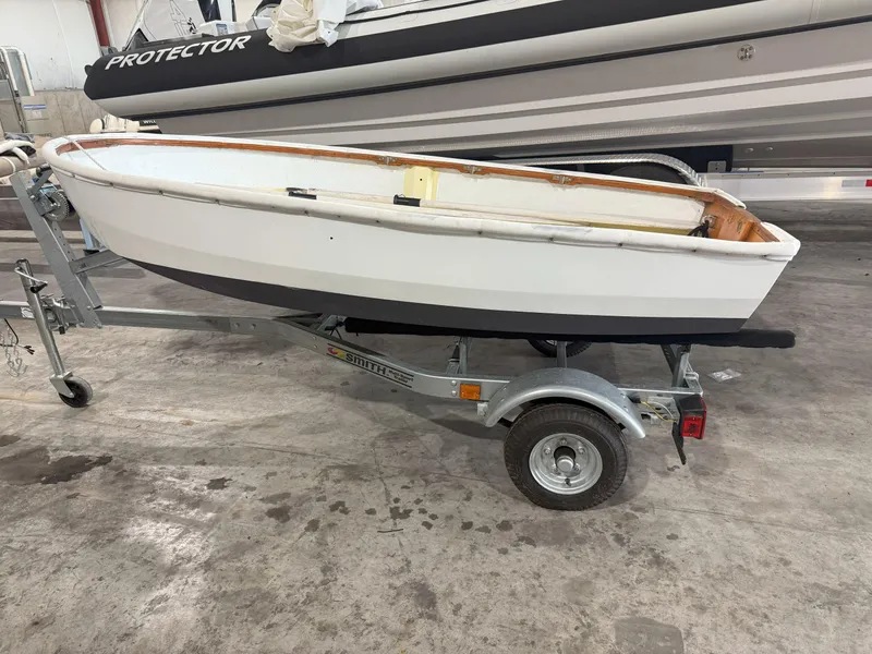 Slide: The Image of 1978 OKEAN Sumner 9 boat on trailer in a garage setting. - 4