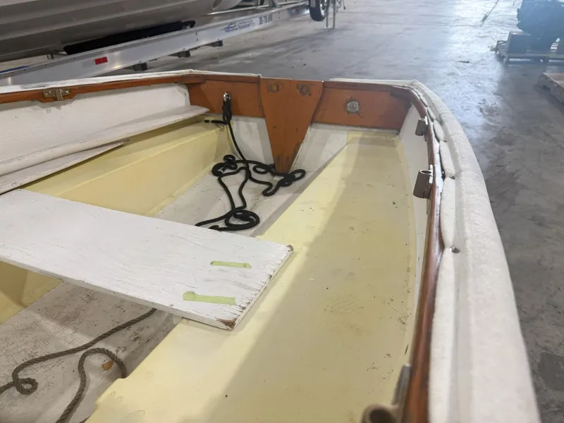 Slide: The Image of Interior of a 1978 OKEAN Sumner 9 boat, showing wooden and rope details. - 7