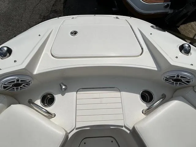 Slide: The Image of 2012 Sea Ray 260 Sundeck boat deck with speakers and cup holders. - 16