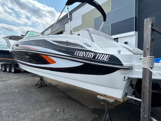 Slide: The Image of 2012 Sea Ray 260 Sundeck boat named "Country Tide" on display outdoors. - 19