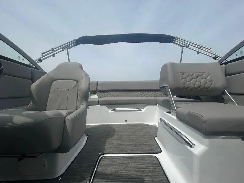 Slide: The Image of 2025 Four Winns H1 Freedom boat interior with gray seating and modern design. - 3