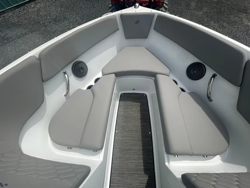 Slide: The Image of 2025 Four Winns H1 Freedom boat interior with gray seating and speakers. - 7