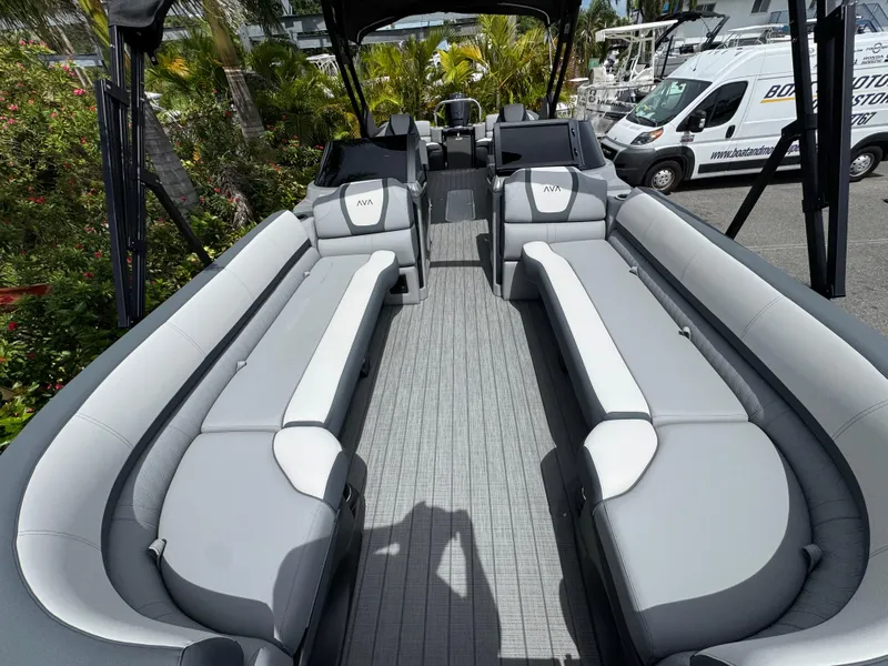 Slide: The Image of 2025 Avalon Catalina Platinum Quad Lounge boat interior with luxurious seating and modern design. - 10