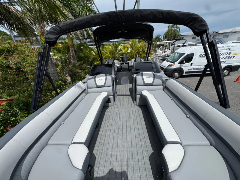 Slide: The Image of 2025 Avalon Catalina Platinum Quad Lounge boat with spacious seating and sleek design. - 11