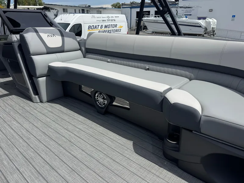 Slide: The Image of 2025 Avalon Catalina Platinum Quad Lounge boat interior with sleek gray seating and modern design. - 12