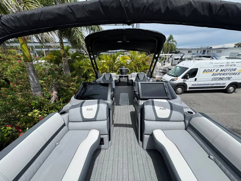 Slide: The Image of 2025 Avalon Catalina Platinum Quad Lounge boat interior with sleek seating and modern design. - 14