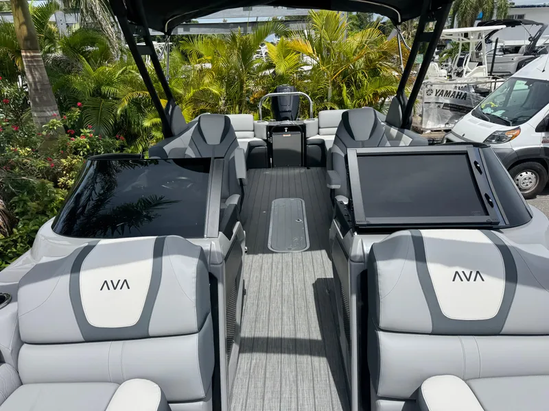 Slide: The Image of 2025 Avalon Catalina Platinum Quad Lounge boat interior with sleek seating and modern design. - 15