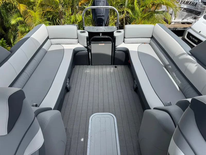 Slide: The Image of 2025 Avalon Catalina Platinum Quad Lounge boat interior with gray seating and sleek design. - 22