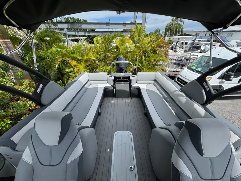 Slide: The Image of 2025 Avalon Catalina Platinum Quad Lounge boat interior with gray seating and modern design. - 23