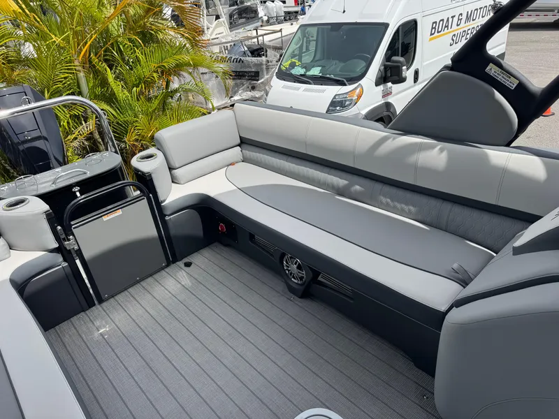 Slide: The Image of 2025 Avalon Catalina Platinum Quad Lounge boat interior with gray seating and modern design. - 28