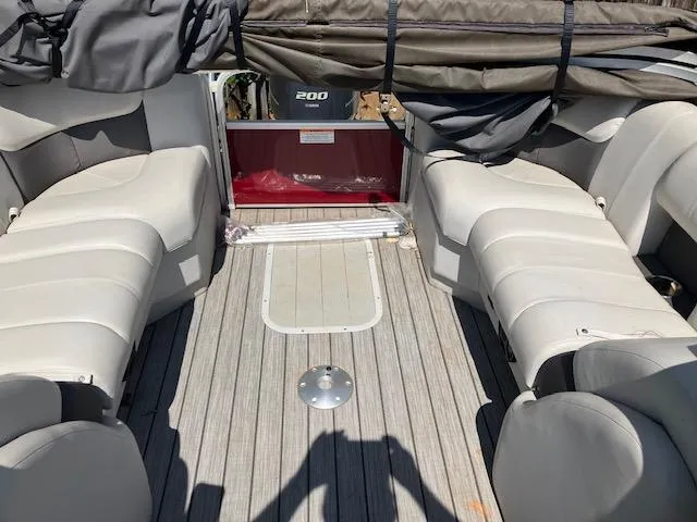 Slide: The Image of 2021 G3 Suncatcher Fusion 322RC interior with gray seating and wood-style flooring. - 5