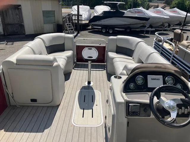 Slide: The Image of 2021 G3 Suncatcher Fusion 322RC pontoon boat interior with seating and steering console. - 6