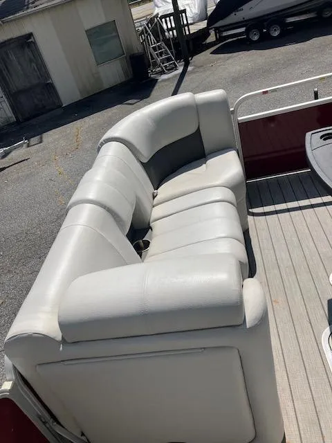 Slide: The Image of White seating on 2021 G3 Suncatcher Fusion 322RC boat, outdoor setting. - 7